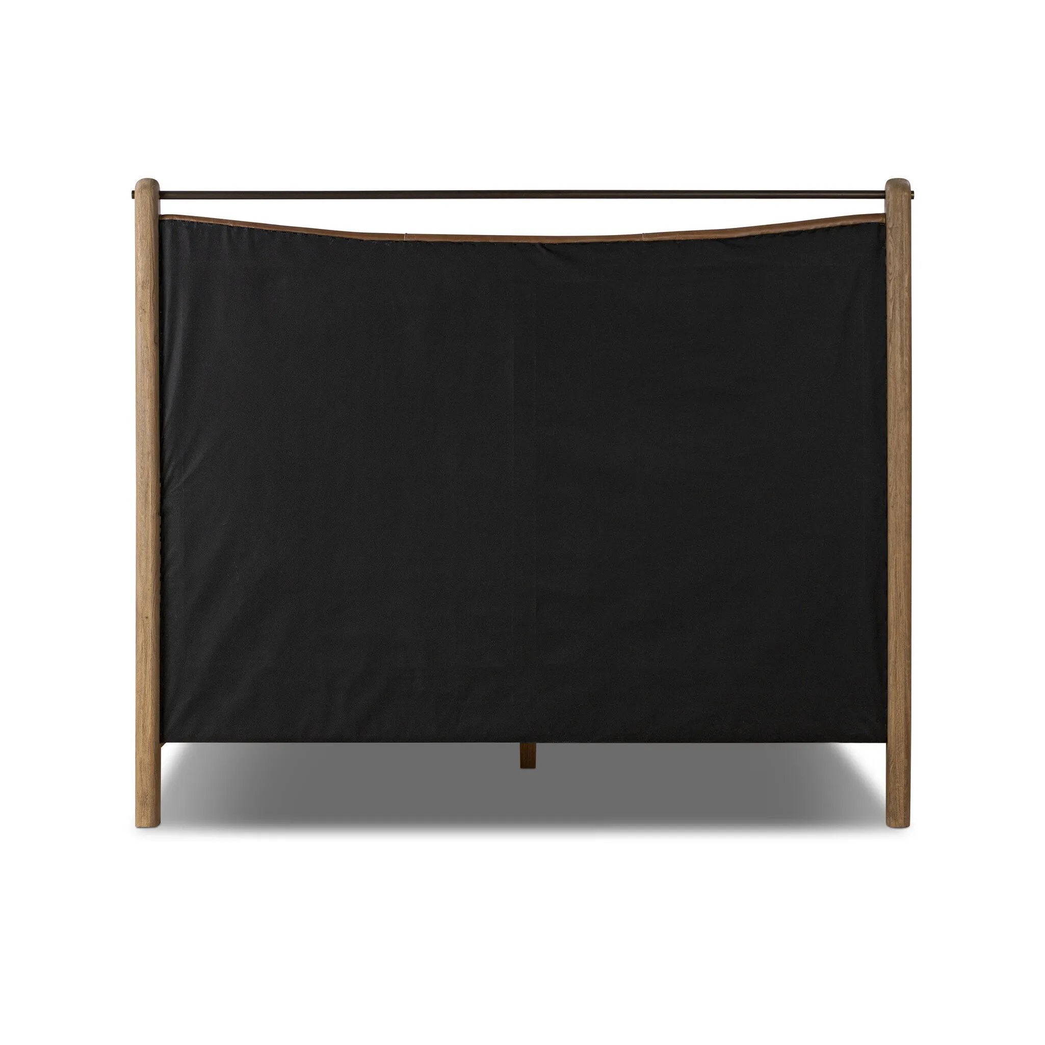 Slightly scooped top-grain leather tufting is bridged with metal bars in brushed brass for modern detailing. Aged smoked oak