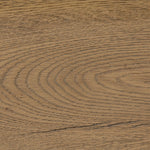 Slightly scooped top-grain leather tufting is bridged with metal bars in brushed brass for modern detailing. Aged smoked oak