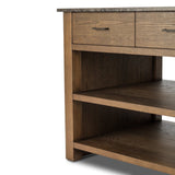 A kitchen island and waterfall dining table in one. Crafted from oak, the island system features two large shelves and three drawers on each side, all  topped with by warm grey marble. The pullout table extends and fits inside the frame with ease Amethyst Home provides interior design, new home construction design consulting, vintage area rugs, and lighting in the Austin metro area.