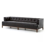 A modernized midcentury silhouette meets the traditional Chesterfield sofa, all in a compact profile perfect for smaller spaces. Top-grain leather in a classic black, button tufting and a smooth touch bring deep comfort to lounging Amethyst Home provides interior design, new home construction design consulting, vintage area rugs, and lighting in the Alpharetta metro area.