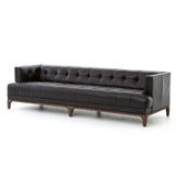 A modernized midcentury silhouette meets the traditional Chesterfield sofa, all in a compact profile perfect for smaller spaces. Top-grain leather in a classic black, button tufting and a smooth touch bring deep comfort to lounging Amethyst Home provides interior design, new home construction design consulting, vintage area rugs, and lighting in the Alpharetta metro area.