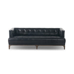 A modernized midcentury silhouette meets the traditional Chesterfield sofa, all in a compact profile perfect for smaller spaces. Top-grain leather in a classic black, button tufting and a smooth touch bring deep comfort to lounging Amethyst Home provides interior design, new home construction design consulting, vintage area rugs, and lighting in the Los Angeles metro area.