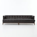 A modernized midcentury silhouette meets the traditional Chesterfield sofa, all in a compact profile perfect for smaller spaces. Top-grain leather in a classic black, button tufting and a smooth touch bring deep comfort to lounging Amethyst Home provides interior design, new home construction design consulting, vintage area rugs, and lighting in the San Diego metro area.