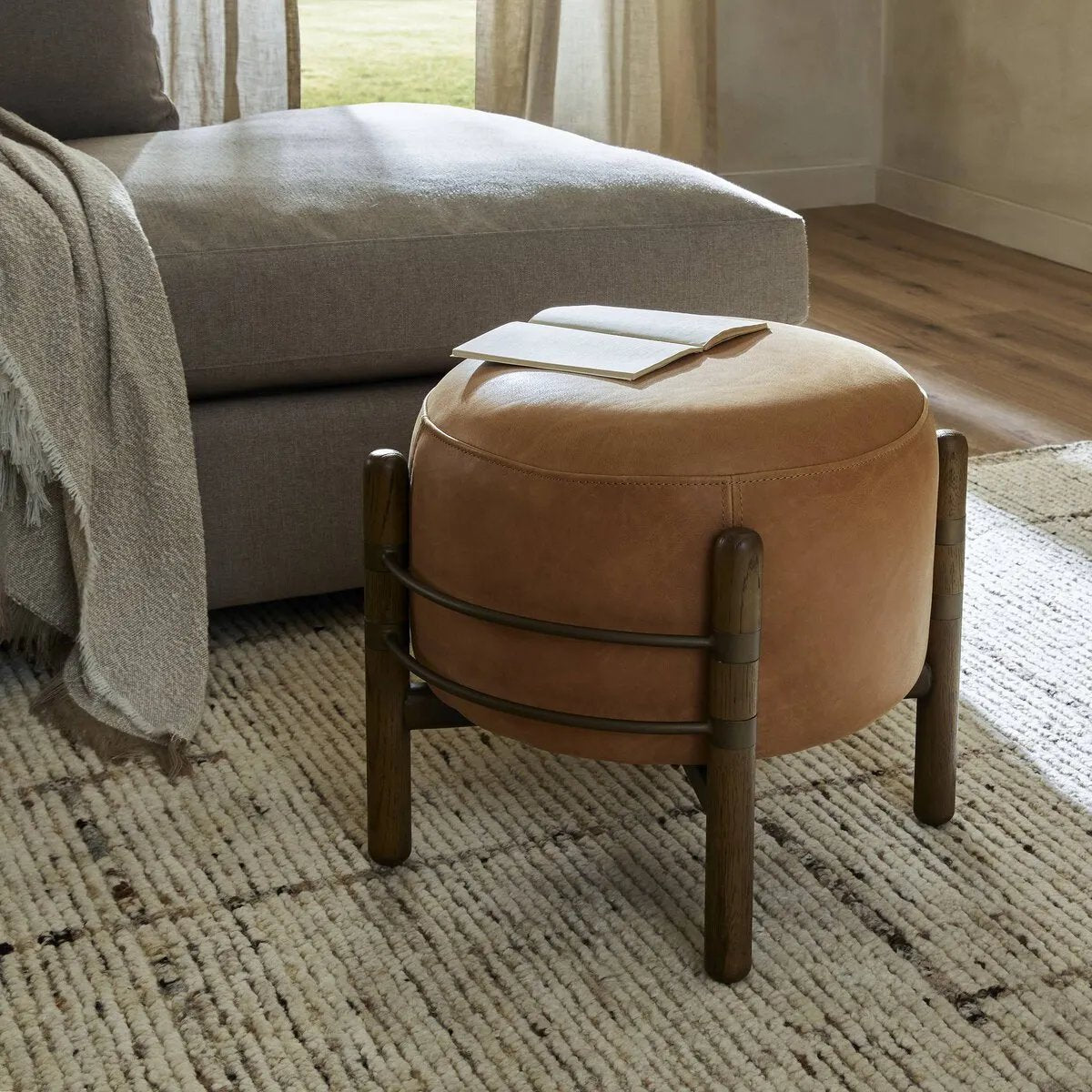 Featuring Enfield Palermo Cognac Ottoman by Four Hands at Amethyst Home. Expertly crafted with high-quality materials, the Enfield Palermo Cognac Ottoman is the ultimate addition to any living space. Its versatile design allows for use as a footrest, extra seating, or even storage. Made with precision and style, this ottoman brings both elegance and functionali. Amethyst Home provides interior design, new home construction design consulting, vintage area rugs, and lighting in the Omaha metro area.