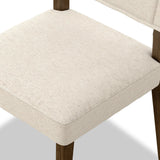 Mixed materials at their finest. Brown parawood forms a slight, simple frame for squared seating of neutral performance-grade upholstery. Charcoal top-grain leather backing takes this modern-minded dining chair to the next level Amethyst Home provides interior design, new home construction design consulting, vintage area rugs, and lighting in the Alpharetta metro area.