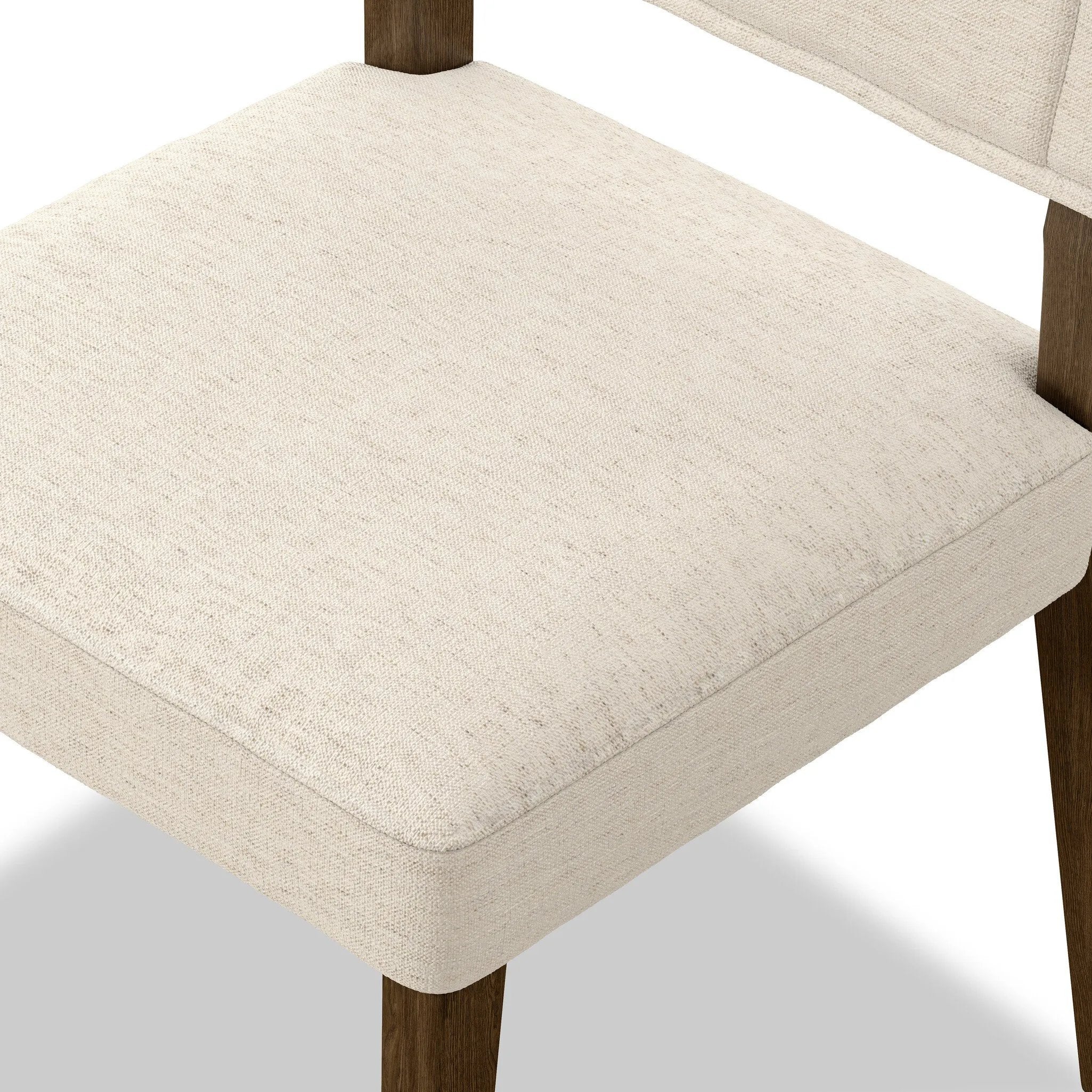 Mixed materials at their finest. Brown parawood forms a slight, simple frame for squared seating of neutral performance-grade upholstery. Charcoal top-grain leather backing takes this modern-minded dining chair to the next level Amethyst Home provides interior design, new home construction design consulting, vintage area rugs, and lighting in the Alpharetta metro area.