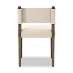 Mixed materials at their finest. Brown parawood forms a slight, simple frame for squared seating of neutral performance-grade upholstery. Charcoal top-grain leather backing takes this modern-minded dining chair to the next level Amethyst Home provides interior design, new home construction design consulting, vintage area rugs, and lighting in the Scottsdale metro area.