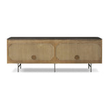 Featuring Fletcher Terra Brown Oak Media Console by Four Hands at Amethyst Home. Rich with reeding for texture and a linear look, this brown oak media console features four doors with brushed brass hardware and curved corners. Its top is a slab of bluestone, adding a striking material mix, while white mineral lines and natural variations mark the uniquenes. Amethyst Home provides interior design, new home construction design consulting, vintage area rugs, and lighting in the Des Moines metro area.
