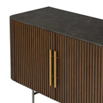 Featuring Fletcher Terra Brown Oak Media Console by Four Hands at Amethyst Home. Rich with reeding for texture and a linear look, this brown oak media console features four doors with brushed brass hardware and curved corners. Its top is a slab of bluestone, adding a striking material mix, while white mineral lines and natural variations mark the uniquen. Amethyst Home provides interior design, new home construction design consulting, vintage area rugs, and lighting in the Laguna Beach metro area.