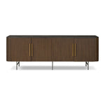 Featuring Fletcher Terra Brown Oak Media Console by Four Hands at Amethyst Home. Rich with reeding for texture and a linear look, this brown oak media console features four doors with brushed brass hardware and curved corners. Its top is a slab of bluestone, adding a striking material mix, while white mineral lines and natural variations mark the uniqueness. Amethyst Home provides interior design, new home construction design consulting, vintage area rugs, and lighting in the Park City metro area.