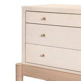 A soft statement console table with ample storage, inspired by a dresser silhouette. The elevated case is wrapped in painted linen and sits atop an oak base for a light and airy look Amethyst Home provides interior design, new home construction design consulting, vintage area rugs, and lighting in the Kansas City metro area.