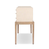 A soft statement console table with ample storage, inspired by a dresser silhouette. The elevated case is wrapped in painted linen and sits atop an oak base for a light and airy look Amethyst Home provides interior design, new home construction design consulting, vintage area rugs, and lighting in the Los Angeles metro area.