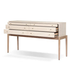 A soft statement console table with ample storage, inspired by a dresser silhouette. The elevated case is wrapped in painted linen and sits atop an oak base for a light and airy look Amethyst Home provides interior design, new home construction design consulting, vintage area rugs, and lighting in the Park City metro area.