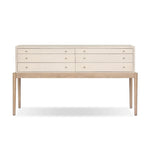 A soft statement console table with ample storage, inspired by a dresser silhouette. The elevated case is wrapped in painted linen and sits atop an oak base for a light and airy look Amethyst Home provides interior design, new home construction design consulting, vintage area rugs, and lighting in the Seattle metro area.