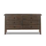 Inspired by French antique design, this dresser stands on round tapered legs with a prominent overhang top. Made of mango wood with cast iron key ring pulls, six drawers make it a versatile addition to the bedroom Amethyst Home provides interior design, new home construction design consulting, vintage area rugs, and lighting in the Austin metro area.