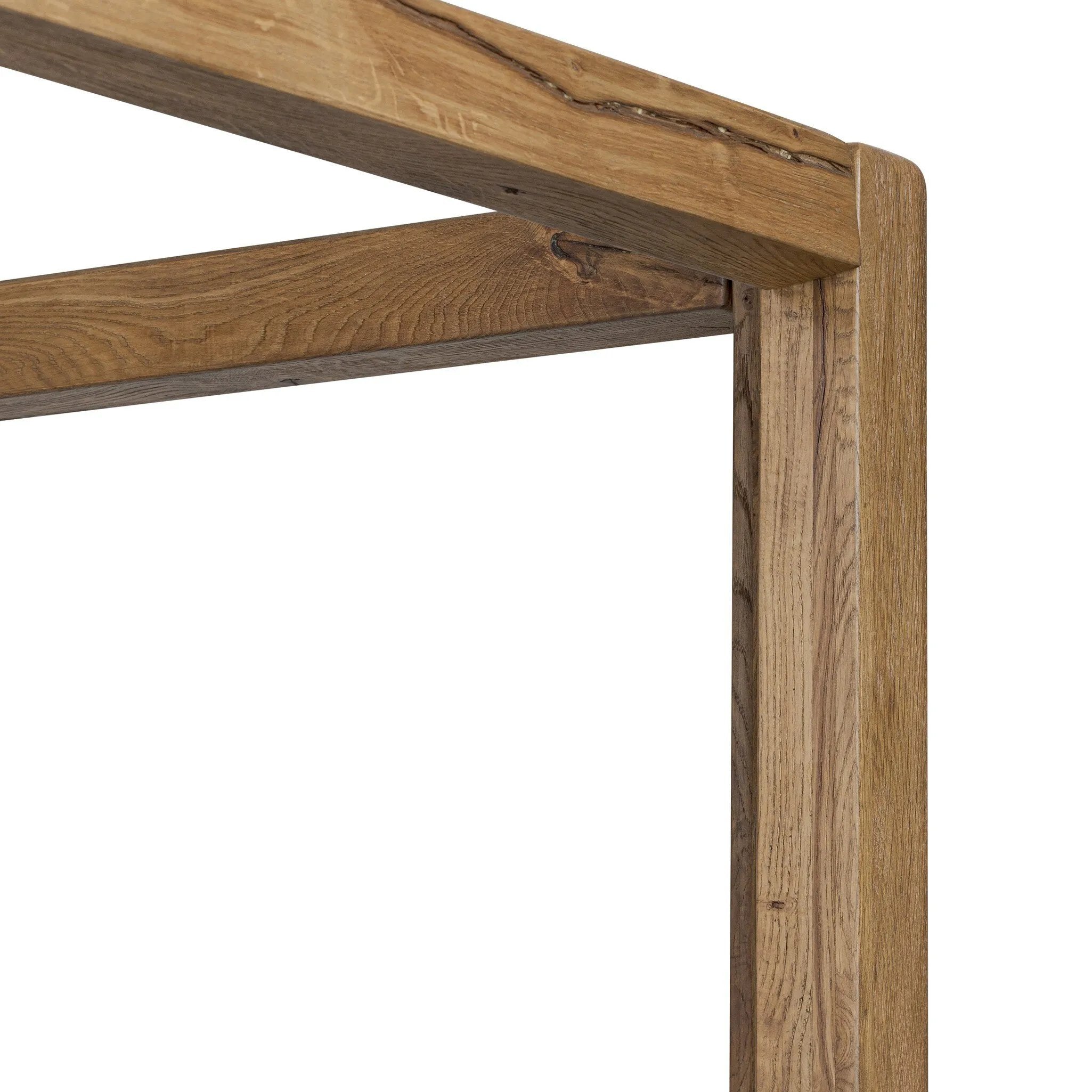 Minimalist and modern, this platform-style canopy bed is framed to a low profile and softened with an upholstered headboard.