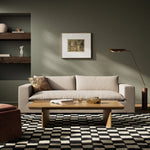 Welcome to the modern lounging essential. A timeless track arm sofa is upholstered in a neutral oatmeal performance fabric and finished with wooden block legs. Performance fabrics are specially created to withstand spills, stains, high traffic and wear, ensuring long-term comfort and unmatched durability Amethyst Home provides interior design, new home construction design consulting, vintage area rugs, and lighting in the Austin metro area.