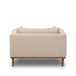 With traditional details like turned oak legs and brass casters, this low-profile accent chair features an elongated bench seat for an inviting sit. Performance fabric in neutral wheat finishes a knife-edge back and boxed arm cushions Amethyst Home provides interior design, new home construction design consulting, vintage area rugs, and lighting in the Houston metro area.