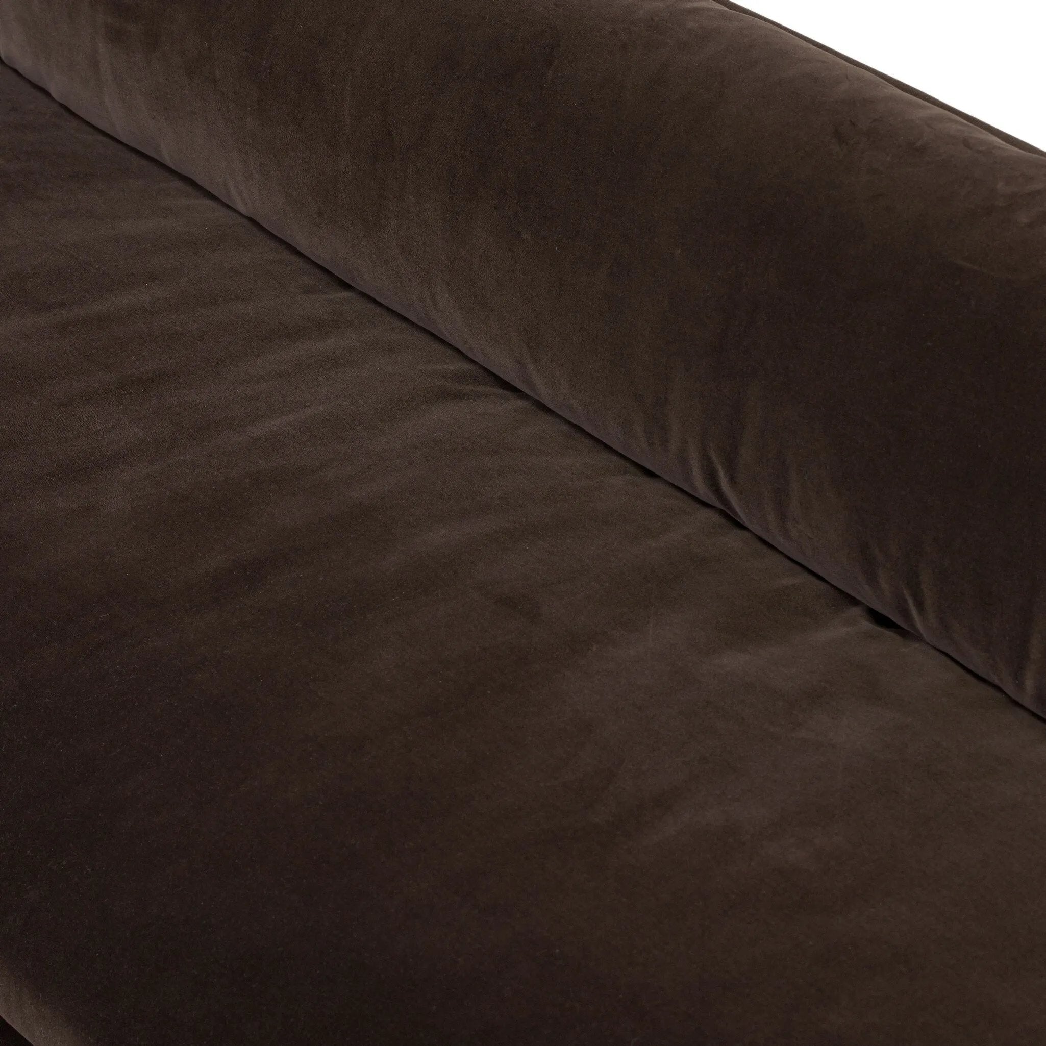 Mid-century modern with a dash of vintage detail, this bench-style sofa makes a statement. With traditional details like turned oak legs and brass casters, this low-profile sofa features an elongated bench seat for an inviting sit. Velvety chocolate-brown upholstery finishes a knife-edge back and boxed arm cushions Amethyst Home provides interior design, new home construction design consulting, vintage area rugs, and lighting in the Nashville metro area.