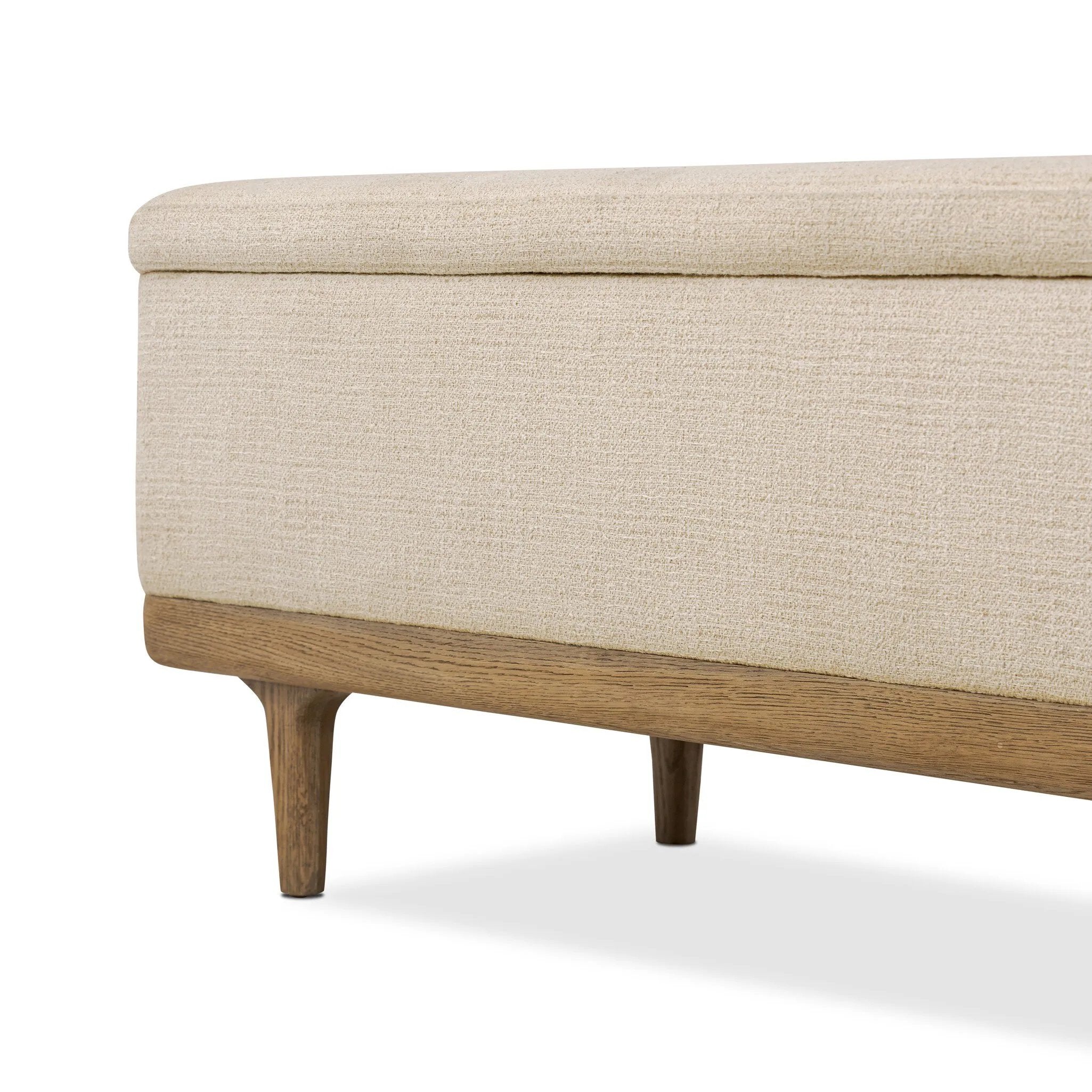 Wrapped in textural cream performance fabric, this spacious trunk doubles as seating at the foot of the bed — or anywhere. Store extra blankets, linens and more. Crafted from oak, the frame and tapered legs with Deco vibes are finished in a worn oak finish. Amethyst Home provides interior design, new home construction design consulting, vintage area rugs, and lighting in the Houston metro area.