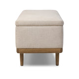 Wrapped in textural cream performance fabric, this spacious trunk doubles as seating at the foot of the bed — or anywhere. Store extra blankets, linens and more. Crafted from oak, the frame and tapered legs with Deco vibes are finished in a worn oak finish. Amethyst Home provides interior design, new home construction design consulting, vintage area rugs, and lighting in the Kansas City metro area.