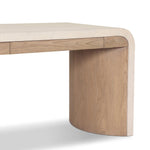 A thick layer of beige painted linen cascades this desk's soft waterfall shape in an eye-catching combination of texture. Crafted atop a mahogany and oak veneer base with rounded corners, this hardworking piece elevates the home-office workspace Amethyst Home provides interior design, new home construction design consulting, vintage area rugs, and lighting in the Washington metro area.