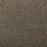 On-trend and expertly tailored, a texture-driven chair is upholstered in an olive flax/linen blend and wrapped with natural rattan, with linear iron legs finished in a complementary gunmetal Amethyst Home provides interior design, new home construction design consulting, vintage area rugs, and lighting in the Dallas metro area.