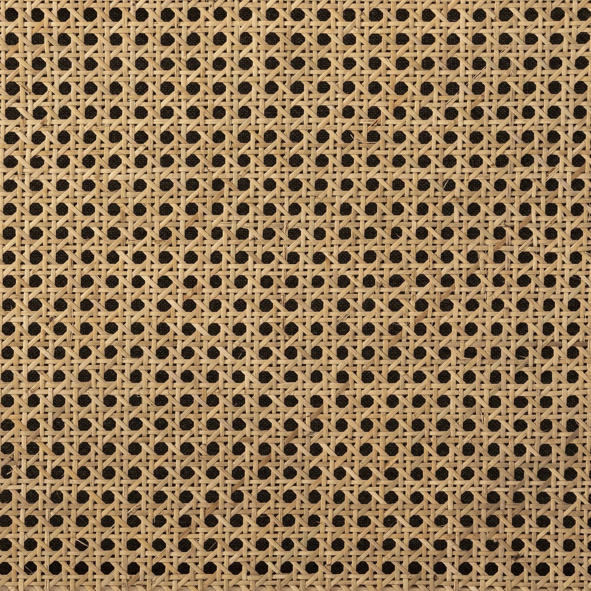 On-trend and expertly tailored, a texture-driven chair is upholstered in an olive flax/linen blend and wrapped with natural rattan, with linear iron legs finished in a complementary gunmetal Amethyst Home provides interior design, new home construction design consulting, vintage area rugs, and lighting in the Tampa metro area.