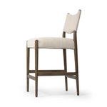 Featuring Jayla Antwerp Natural Stool by Four Hands at Amethyst Home. A midcetury-inspired piece, updated for modern times. A supportive back and seat cushion are upholstered in high-performance fabric, with walnut-finished wooden armrests prime for the head of the table. Perfectly sized for the counter. Steam regularly to keep fabric looking crisp. Performanc. Amethyst Home provides interior design, new home construction design consulting, vintage area rugs, and lighting in the Austin metro area.