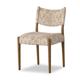 A midcentury-inspired piece brought to modern times. A supportive, sling-style back and seat cushion are upholstered in a soft, velvety fabric, with toasted oak armless framing Amethyst Home provides interior design, new home construction design consulting, vintage area rugs, and lighting in the Dallas metro area.