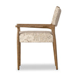 A midcentury-inspired piece brought to modern speed. A supportive, sling-style back and seat cushion are upholstered in a soft, velvety fabric, with toasted oak arms prime for the head of the table Amethyst Home provides interior design, new home construction design consulting, vintage area rugs, and lighting in the Salt Lake City metro area.