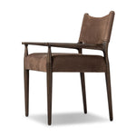 A midcentury-inspired piece brought to modern speed. A supportive, sling-style back and seat cushion are upholstered in a soft, velvety fabric, with toasted oak arms prime for the head of the table Amethyst Home provides interior design, new home construction design consulting, vintage area rugs, and lighting in the Scottsdale metro area.