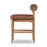 Featuring Jazelle Taupe Shearling Counter Stool by Four Hands at Amethyst Home. Bring mixed materials to the counter. Solid oak, top-grain leather and soft shearling fuse for a playful update to midcentury and Seventies styling. Overall Dimensions: 22.25"w x 25.75"d x 36.50"h. Amethyst Home provides interior design, new home construction design consulting, vintage area rugs, and lighting in the Austin metro area.