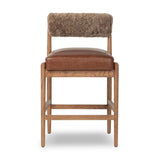 Featuring Jazelle Taupe Shearling Counter Stool by Four Hands at Amethyst Home. Bring mixed materials to the counter. Solid oak, top-grain leather and soft shearling fuse for a playful update to midcentury and Seventies styling. Overall Dimensions: 22.25"w x 25.75"d x 36.50"h. Amethyst Home provides interior design, new home construction design consulting, vintage area rugs, and lighting in the Boston metro area.