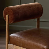 Featuring Jazelle Altair Sienna Counter Stool by Four Hands at Amethyst Home. The classic counter stool gets a playful update with a bolstered cylinder seat back. Made from top-grain leather and warm-finished oak to elevate your bar, kitchen or dining space. Overall Dimensions: 22.25"w x 25.75"d x 36.50"h. Amethyst Home provides interior design, new home construction design consulting, vintage area rugs, and lighting in the Los Angeles metro area.