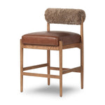 Featuring Jazelle Taupe Shearling Counter Stool by Four Hands at Amethyst Home. Bring mixed materials to the counter. Solid oak, top-grain leather and soft shearling fuse for a playful update to midcentury and Seventies styling. Overall Dimensions: 22.25"w x 25.75"d x 36.50"h. Amethyst Home provides interior design, new home construction design consulting, vintage area rugs, and lighting in the Miami metro area.