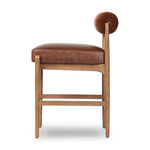 Featuring Jazelle Altair Sienna Counter Stool by Four Hands at Amethyst Home. The classic counter stool gets a playful update with a bolstered cylinder seat back. Made from top-grain leather and warm-finished oak to elevate your bar, kitchen or dining space. Overall Dimensions: 22.25"w x 25.75"d x 36.50"h. Amethyst Home provides interior design, new home construction design consulting, vintage area rugs, and lighting in the Portland metro area.