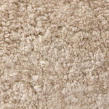 With a supple pile that's soft to the touch, taupe shearling upholstery pairs with an S-spring seat and enveloped frame for an inviting look and feel on this 360-degree swivel chair Amethyst Home provides interior design, new home construction design consulting, vintage area rugs, and lighting in the Austin metro area.