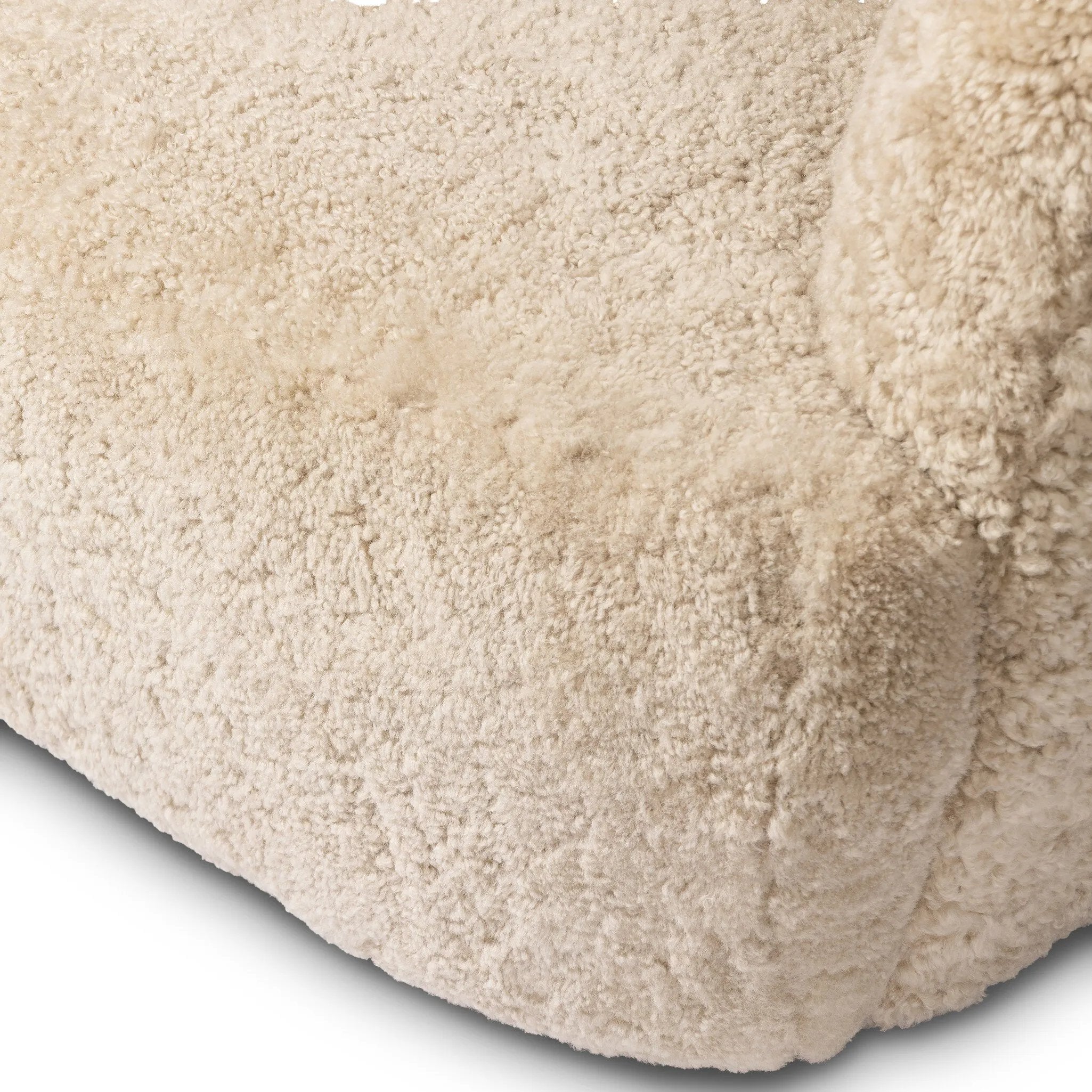 With a supple pile that's soft to the touch, taupe shearling upholstery pairs with an S-spring seat and enveloped frame for an inviting look and feel on this 360-degree swivel chair Amethyst Home provides interior design, new home construction design consulting, vintage area rugs, and lighting in the Nashville metro area.