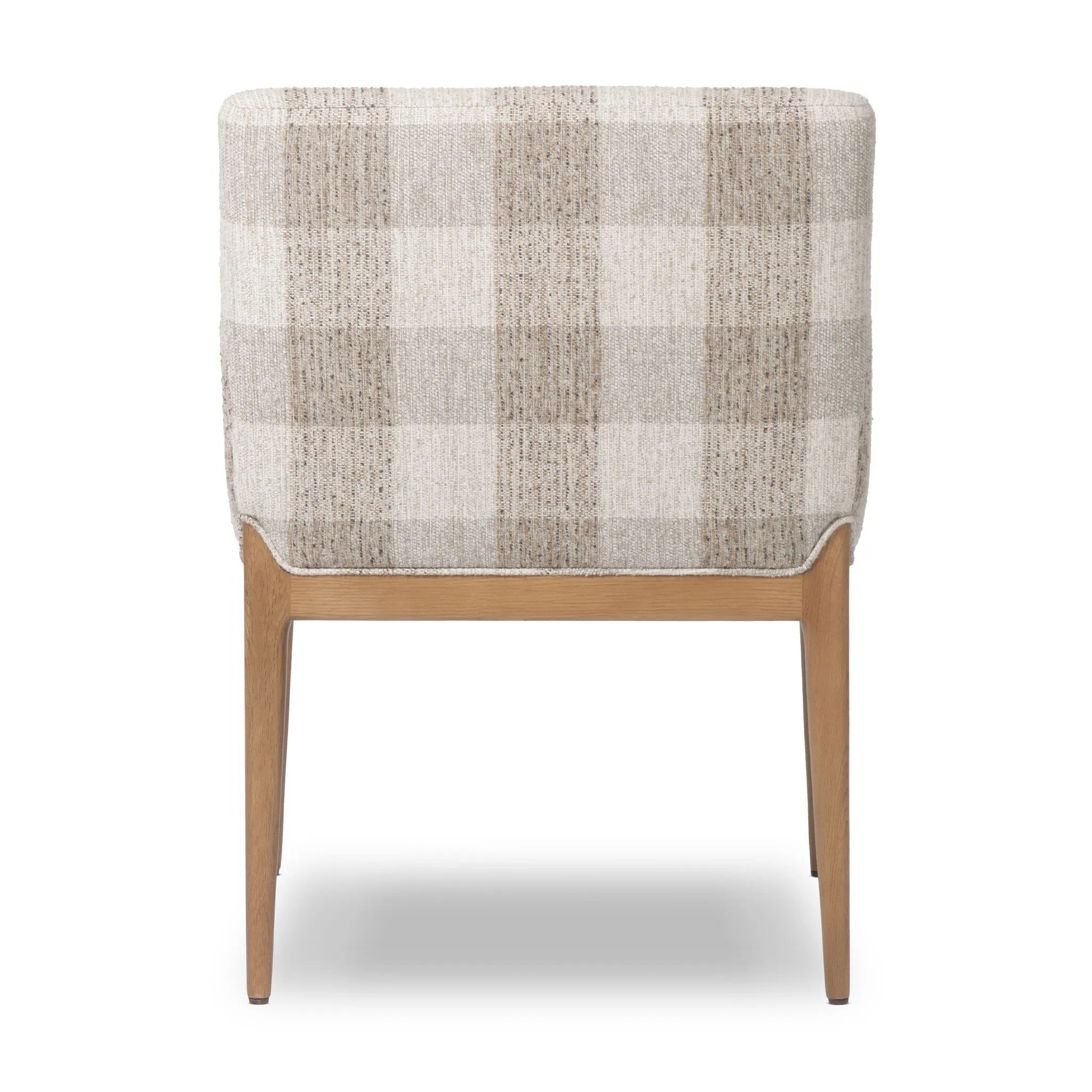 Featuring Ledger Dresden Pebble Dining Chair by Four Hands at Amethyst Home. A patterned dining chair that’s all about comfort. Checkered-print upholstery is framed by light, warm oak, while a boxy profile and higher arms feel prime for the head of the table. Overall Dimensions: 24.50"w x 26.00"d x 33.25"h. Amethyst Home provides interior design, new home construction design consulting, vintage area rugs, and lighting in the Boston metro area.