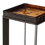 Featuring Lennie Amber Cast Glass Cast Glass End Table by Four Hands at Amethyst Home. An airy, angular base of charcoal-burnished iron supports a squared tabletop of amber cast glass, perfectly sized to keep your drink or book within reach.Overall Dimensions: 12.50"w x 12.50"d x 22.00"hWeight : 36.38 lbsMaterials : Cast Glass, Iron. Amethyst Home provides interior design, new home construction design consulting, vintage area rugs, and lighting in the Houston metro area.