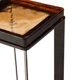 Featuring Lennie Amber Cast Glass Cast Glass End Table by Four Hands at Amethyst Home. An airy, angular base of charcoal-burnished iron supports a squared tabletop of amber cast glass, perfectly sized to keep your drink or book within reach.Overall Dimensions: 12.50"w x 12.50"d x 22.00"hWeight : 36.38 lbsMaterials : Cast Glass, Iron. Amethyst Home provides interior design, new home construction design consulting, vintage area rugs, and lighting in the Scottsdale metro area.