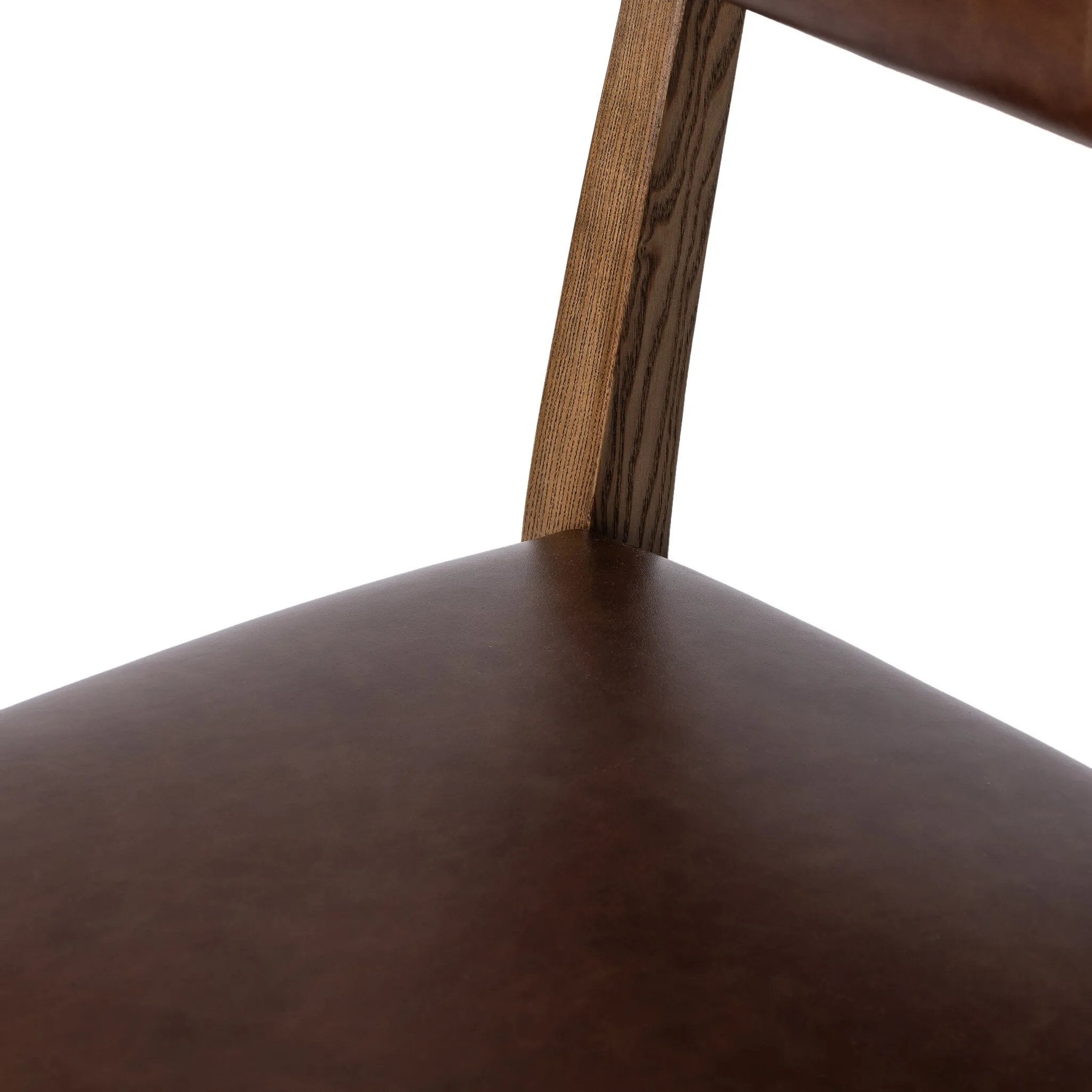 Both modern and traditional, toasted oak frames this high-back, armless dining chair. Finished with a rich brown top-grain leather, with hanging straps affixed to the back Amethyst Home provides interior design, new home construction design consulting, vintage area rugs, and lighting in the Boston metro area.