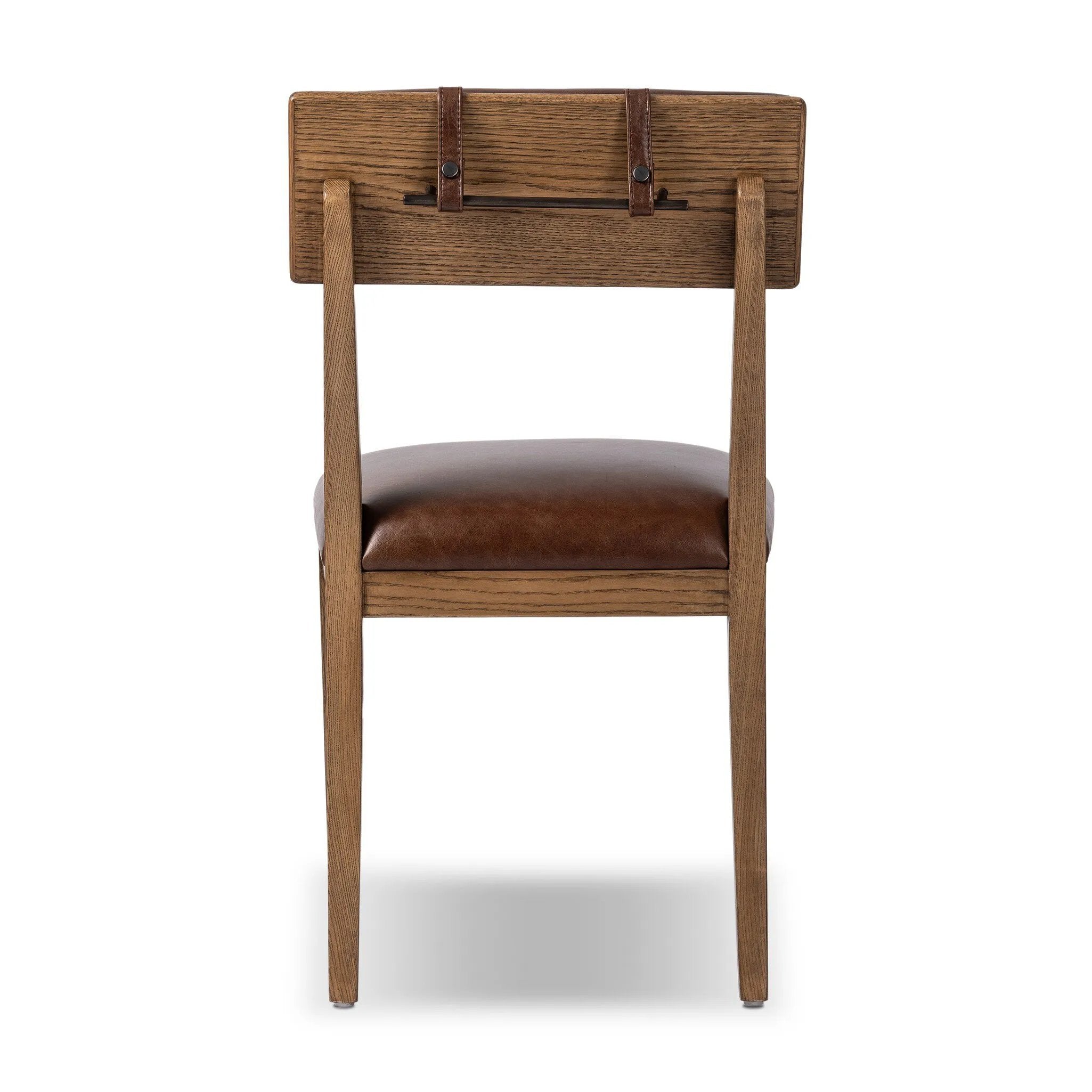 Both modern and traditional, toasted oak frames this high-back, armless dining chair. Finished with a rich brown top-grain leather, with hanging straps affixed to the back Amethyst Home provides interior design, new home construction design consulting, vintage area rugs, and lighting in the Kansas City metro area.