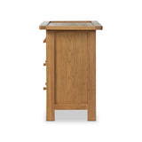 Drawing inspiration from a vintage general store counter, a storage-driven dresser reflects traditional and functional design. Thick oak legs with softened corners provide sturdy support, while oak knobs add a classic touch. An inset tray top and a versatile drawer configuration offer ample storage Amethyst Home provides interior design, new home construction design consulting, vintage area rugs, and lighting in the Houston metro area.