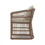 Cottage-inspired, faux hyacinth mimics its natural counterpart, with joint wrapping and texture for depth and character defining this outdoor dining chair. Varied proportion for dimension. Upholstered in a UV-resistant, water-repellent, quick-drying fabric. Cover or store indoors during inclement weather and when not in use Amethyst Home provides interior design, new home construction design consulting, vintage area rugs, and lighting in the Scottsdale metro area.