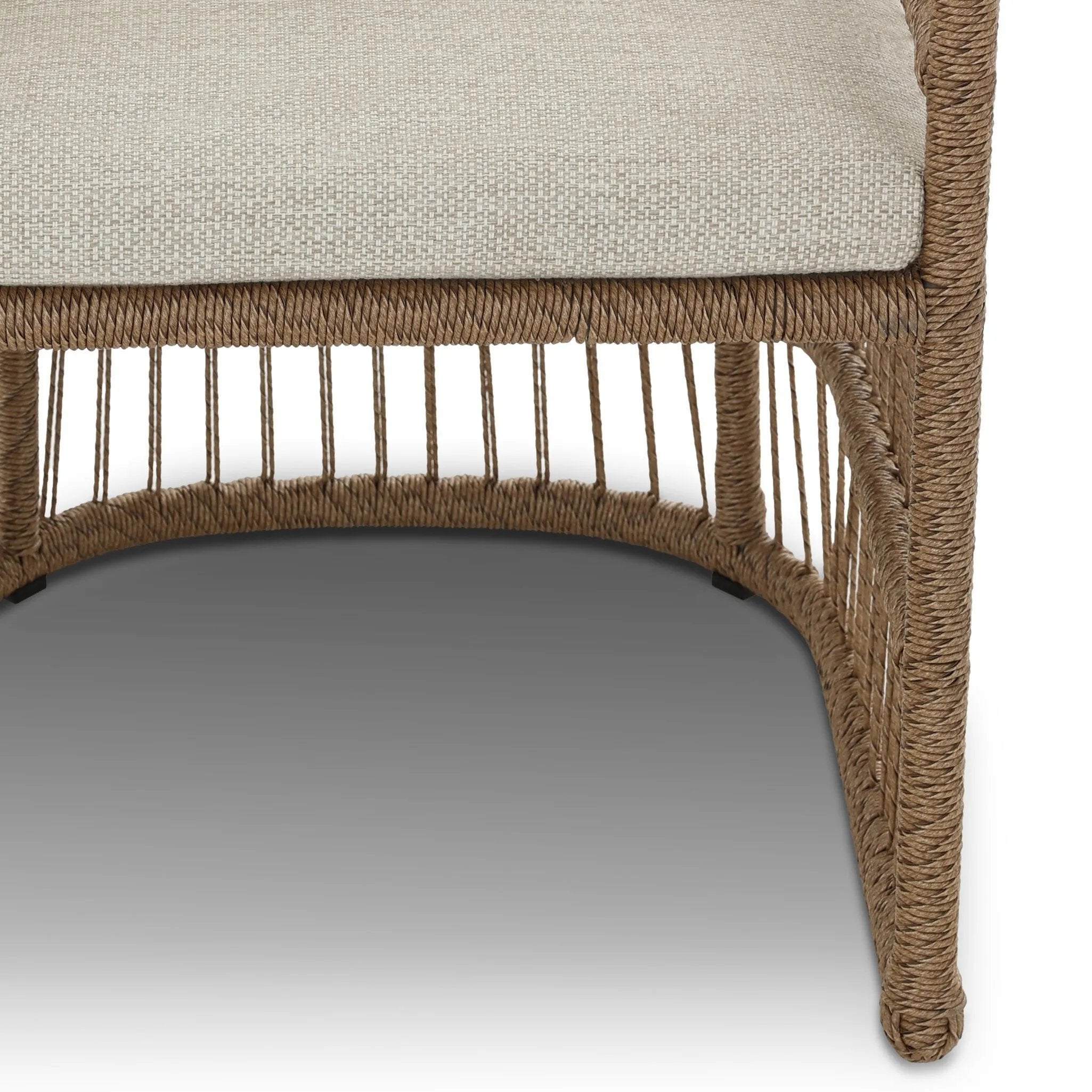Cottage-inspired, faux hyacinth mimics its natural counterpart, with joint wrapping and texture for depth and character defining this outdoor dining chair. Varied proportion for dimension. Upholstered in a UV-resistant, water-repellent, quick-drying fabric. Cover or store indoors during inclement weather and when not in use Amethyst Home provides interior design, new home construction design consulting, vintage area rugs, and lighting in the Seattle metro area.