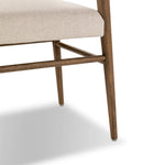 Mixed materials place a modern twist on the sling-back dining chair. A solid oak frame forms rounded dowel legs for a touch of traditionalism, with top-grain leather in a warm chestnut Amethyst Home provides interior design, new home construction design consulting, vintage area rugs, and lighting in the Dallas metro area.