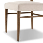 Mixed materials place a modern twist on the sling-back dining chair. A solid oak frame forms rounded dowel legs for a touch of traditionalism, with top-grain leather in a warm chestnut Amethyst Home provides interior design, new home construction design consulting, vintage area rugs, and lighting in the Houston metro area.