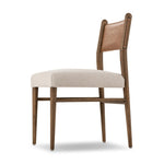 Mixed materials place a modern twist on the sling-back dining chair. A solid oak frame forms rounded dowel legs for a touch of traditionalism, with top-grain leather in a warm chestnut Amethyst Home provides interior design, new home construction design consulting, vintage area rugs, and lighting in the Scottsdale metro area.